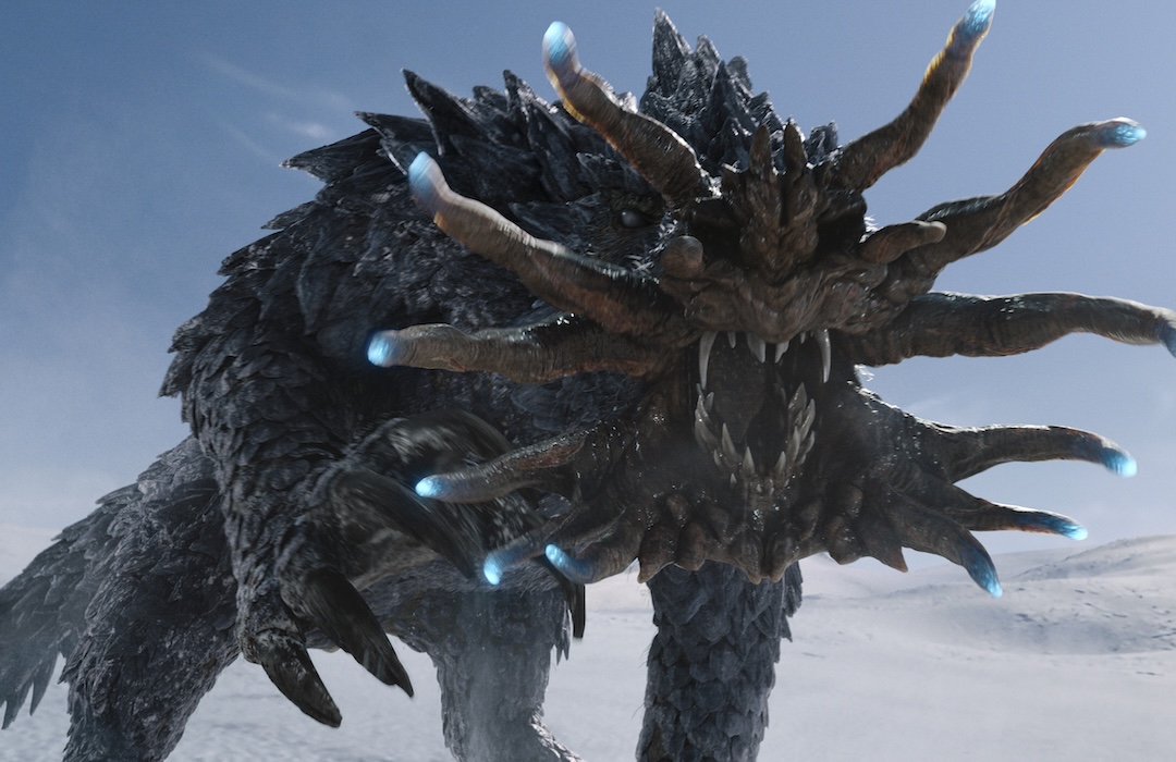 An armored monster with a tentacled face roars aggressively in a snowy, frozen landscape.